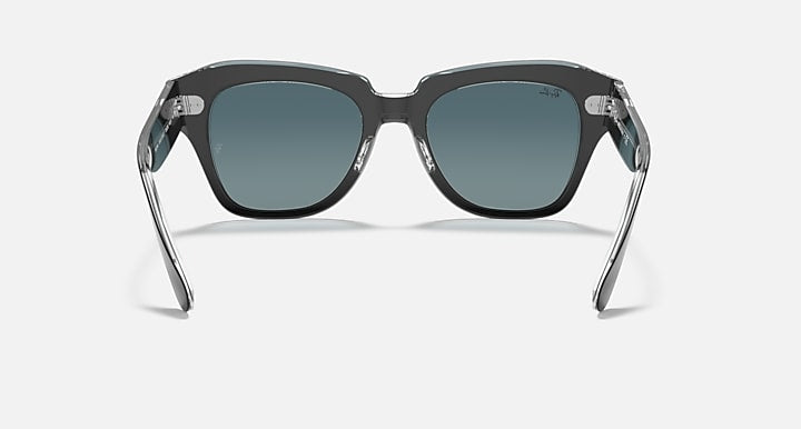 Ray-Ban State Street RB2186 sunglasses front view, clear black frame with blue lenses