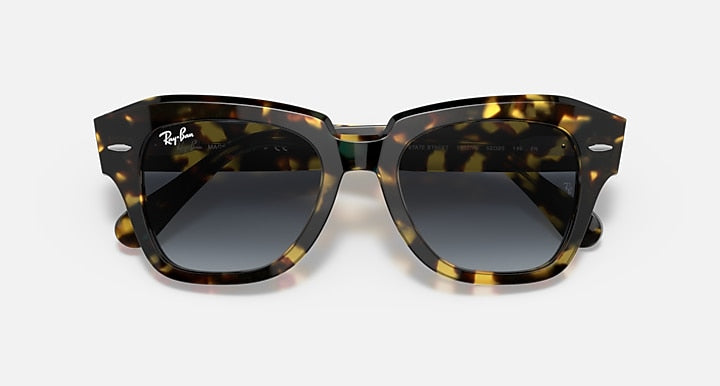 Tortoiseshell square sunglasses with dark lenses and thick frame, front view