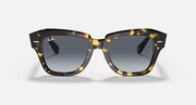 Tortoiseshell square sunglasses with dark grey gradient lenses, front view
