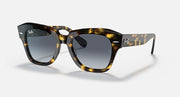 Tortoiseshell square sunglasses with dark grey gradient lenses and thick plastic frame