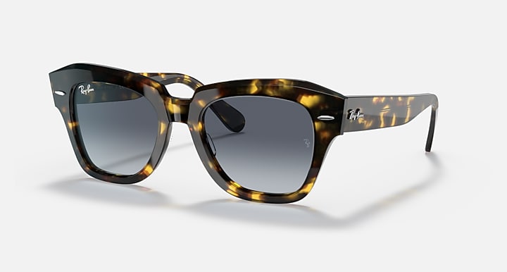 Tortoiseshell square sunglasses with dark grey gradient lenses and thick plastic frame