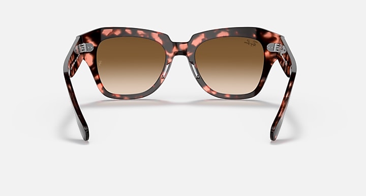 Tortoise square-frame sunglasses with brown gradient lenses, front view.
