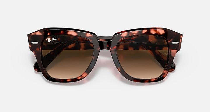 Tortoise square-frame sunglasses with brown lenses, angled top view.
