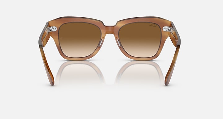 Brown havana sunglasses, angled front view with amber lenses and notch bridge