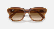 Brown havana sunglasses with dark amber lenses and wide squared frames