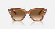 Brown havana sunglasses, front view with amber gradient lenses and sculpted frame