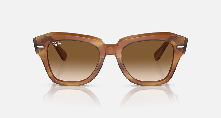 Brown havana sunglasses, front view with amber gradient lenses and sculpted frame