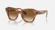 Brown havana sunglasses with amber lenses and Wayfarer-style cat-eye silhouette