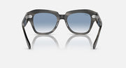 Black sunglasses, front view with blue lenses and angular oversized frames