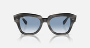 Black sunglasses, front view with light blue lenses and sculpted top edge