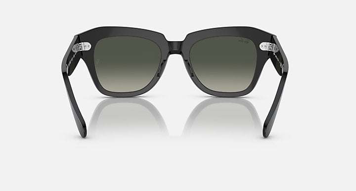Matte black square-frame sunglasses with dark green lenses, straight-on view.
