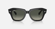 Black square-frame sunglasses with dark green lenses, front view.