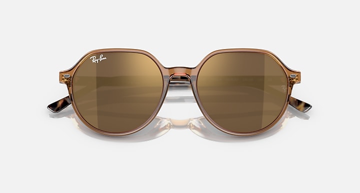 Ray-Ban Thalia RB2195 round sunglasses with tan lenses and gold-tone frame