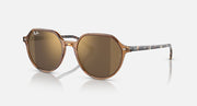 Ray-Ban Thalia RB2195 round sunglasses with brown-tinted lenses and gold-tone frame
