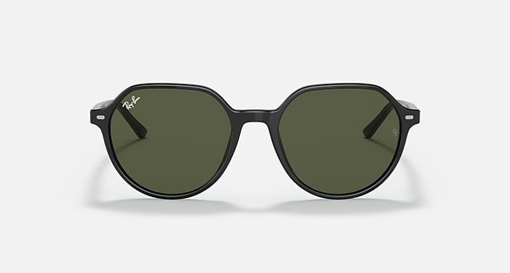 Round black sunglasses with dark green lenses and a low-profile bridge.