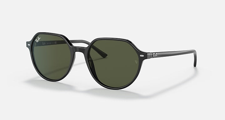 Round black sunglasses with dark green tinted lenses and slim arms.