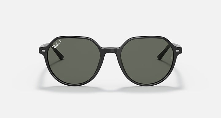 Round black sunglasses with dark green lenses and short, angled temple tips.
