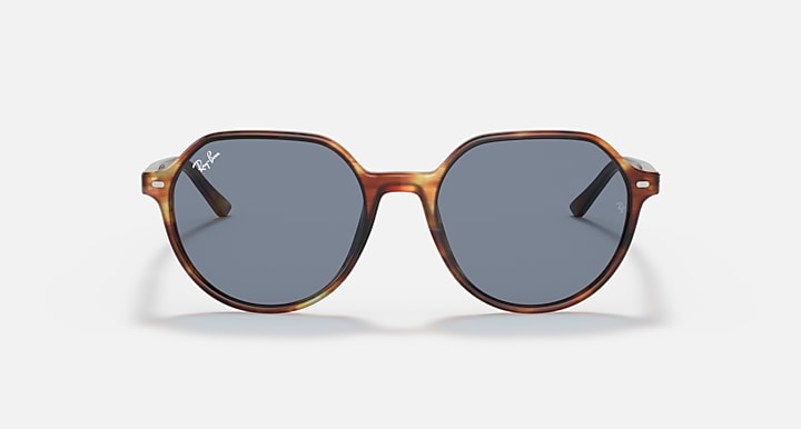 Ray-Ban Thalia RB2195 sunglasses with blue-gray lenses and tortoise-style round frame