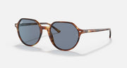 Ray-Ban Thalia RB2195 sunglasses with blue-gray lenses and brown round frames