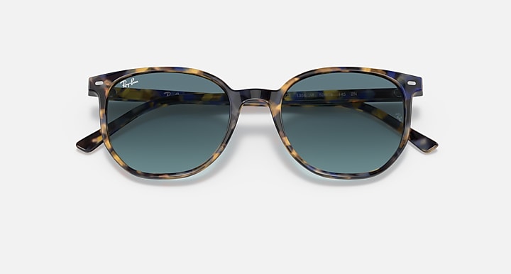 Sunglasses with tortoiseshell-pattern frame and dark blue lenses, front view.