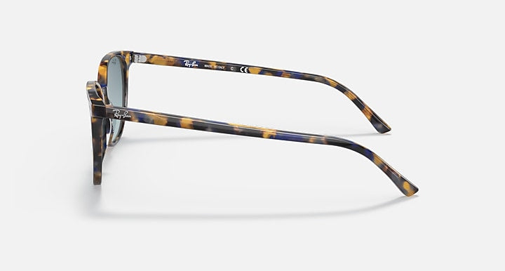 Sunglasses side view with tortoiseshell-pattern frame and blue gradient lens tint.