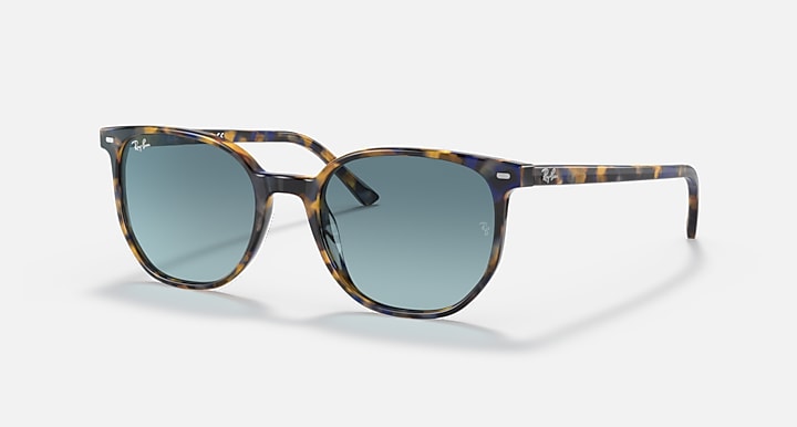 Sunglasses with tortoiseshell-pattern frame and blue gradient lenses, side profile.