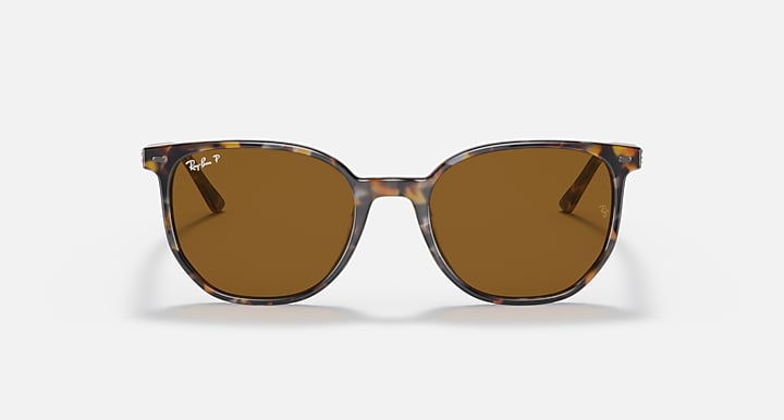 Tortoise-frame sunglasses with brown round lenses and thin metal bridge.