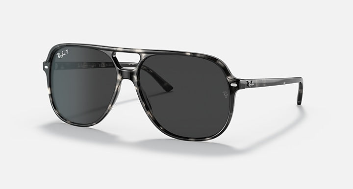 Ray-Ban Bill sunglasses with dark lenses and black frame, rectangular aviator style