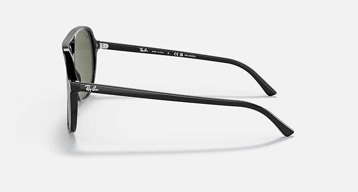 Ray-Ban Bill sunglasses side view with black frame and dark green lens.