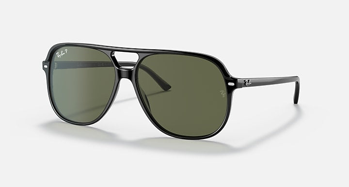 Ray-Ban Bill sunglasses angled front view, black frame with dark green tinted lenses.