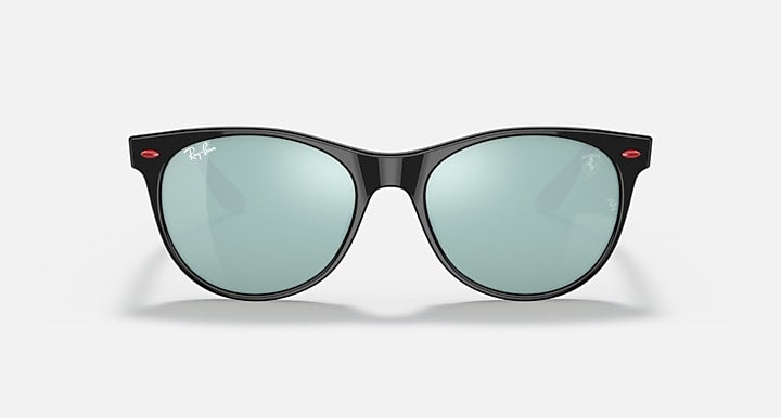 Black cat-eye sunglasses with light green mirrored lenses and red accents at temples