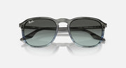 Ray-Ban RB2203 sunglasses with dark green lenses, black frame, top-front angle