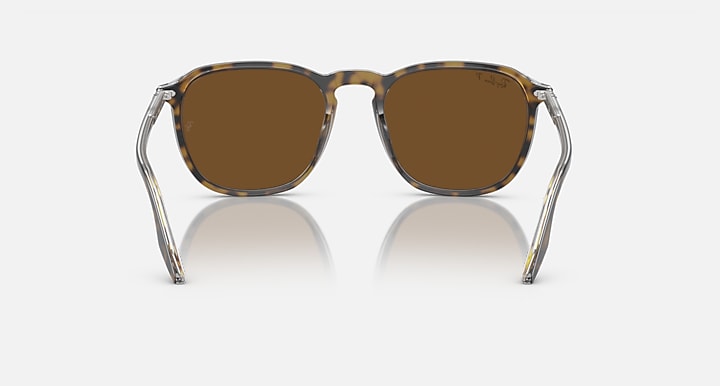 Clear frame round sunglasses with brown tinted lenses