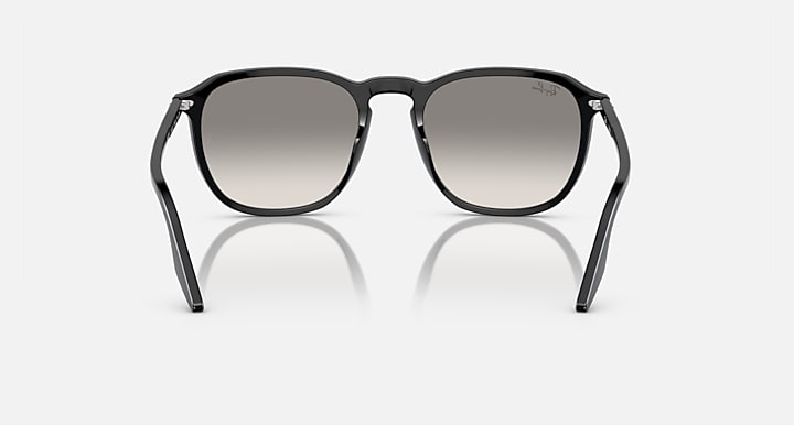 Black round sunglasses with light gray tinted lenses
