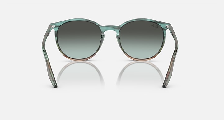 Ray-Ban green sunglasses with round dark lenses and transparent frame, front view.