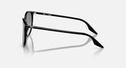Round sunglasses, side view, black frame with metal accents and gray lenses