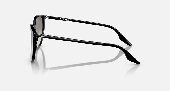 Round sunglasses, side view, black frame with metal accents and gray lenses