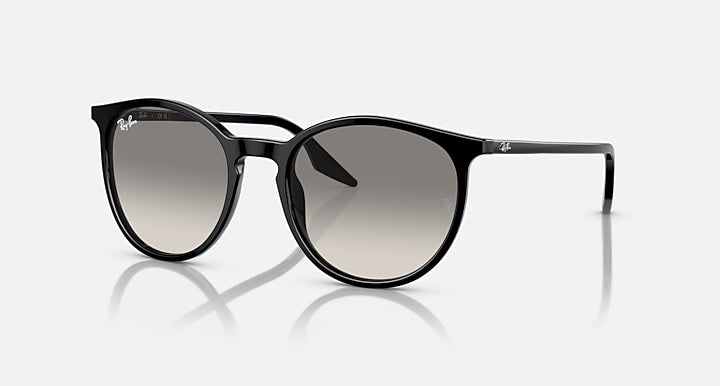 Oversized round sunglasses with black frame and gray-tinted lenses