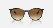 Oversized round sunglasses with tortoise frame and warm brown lenses