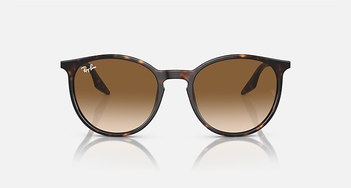Oversized round sunglasses with tortoise frame and warm brown lenses