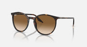 Oversized round sunglasses with tortoise frame and amber-brown lenses