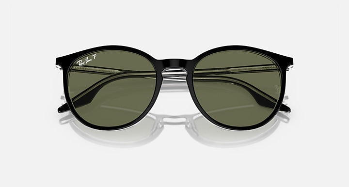 Ray-Ban round sunglasses with dark green lenses and black frame, mirrored look