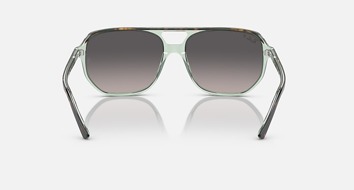 Ray-Ban Bill One sunglasses, green frame with dark lenses and rounded shape.