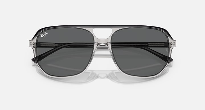 Ray-Ban Bill One RB2205 sunglasses, transparent frame with dark gray lenses and black top bars.