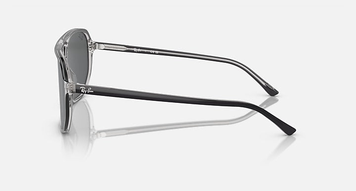 Ray-Ban Bill One RB2205 sunglasses, side profile with transparent frame and dark gray lens.