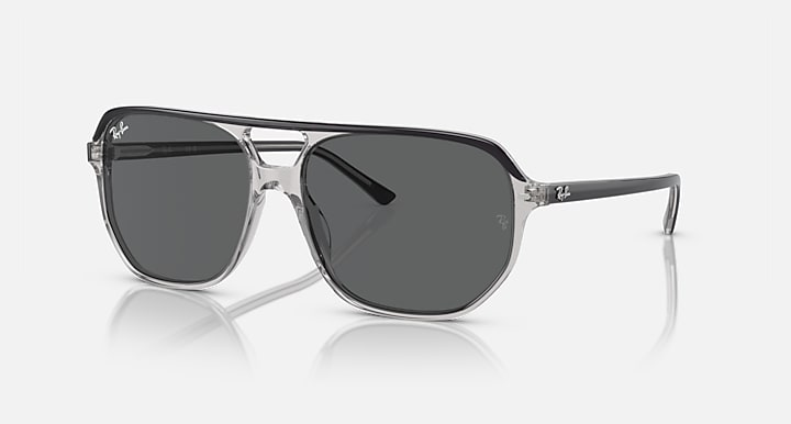 Ray-Ban Bill One RB2205 sunglasses, transparent frame with dark gray lenses and side logo.