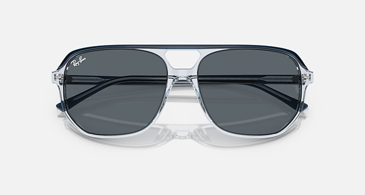 Ray-Ban Bill One RB2205 sunglasses, transparent frame with dark gray lenses and black top bars.