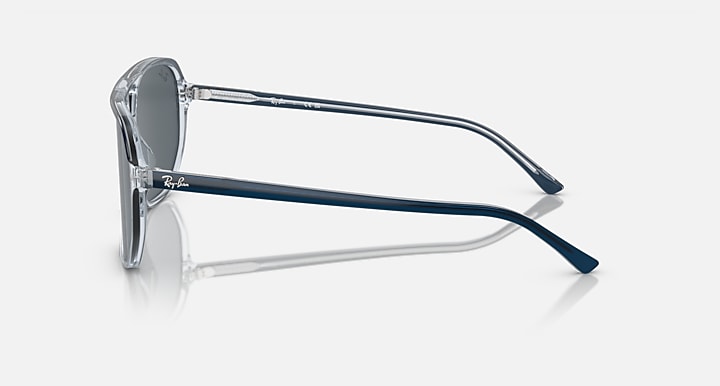 Ray-Ban Bill One RB2205 sunglasses, side profile with transparent frame and blue temple accents.
