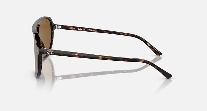 Ray-Ban Bill One sunglasses, side profile with tortoiseshell frame and amber-brown lens