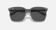 Sunglasses with dark lenses and clear gray frame, front view with thick temples